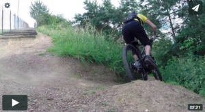 During the mini enduro cup a enduro biker is taking the turn on the trails